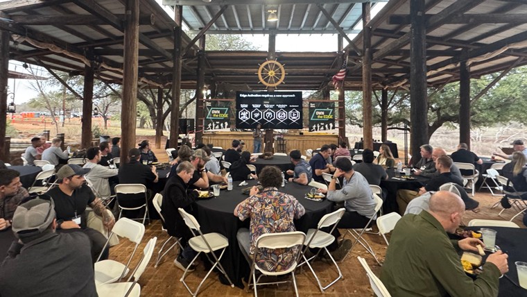 People eating at an outdoor picnic area at Reville Peak Ranch
