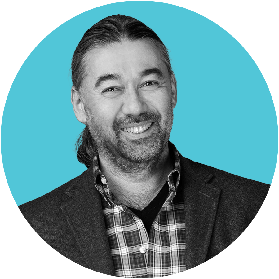 Headshot of Haluk Saker in business casual attire