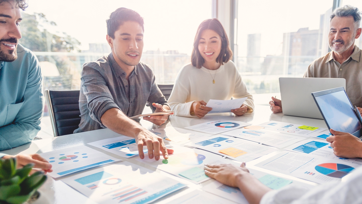 image of people working at a board room table