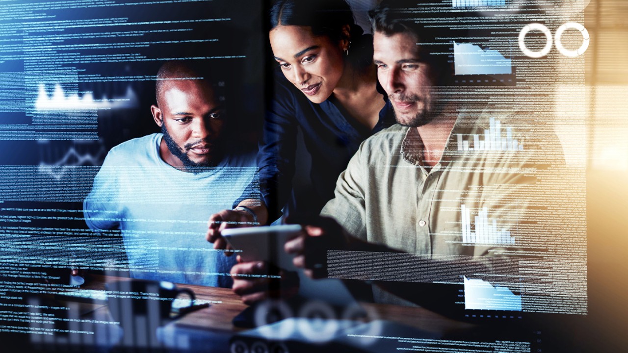 Group of workers uses a digital tablet to collaborate