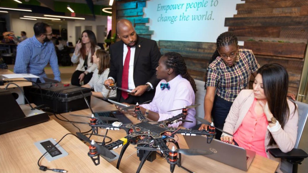Diverse group of Booz Allen workers working together
